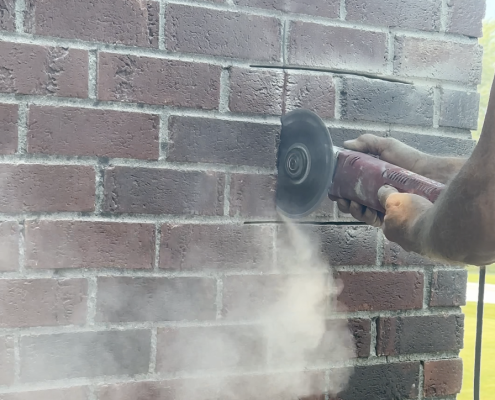 Cutting bricks with masonry blade for Honeybee Removal