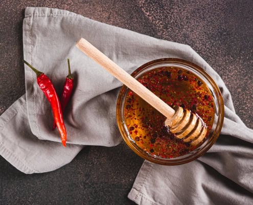 Raw honey with chili peppers, natural honey, spicy honey, health benefits, The Mindful Beekeeper.