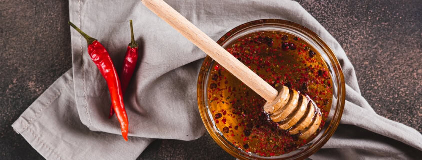 Raw honey with chili peppers, natural honey, spicy honey, health benefits, The Mindful Beekeeper.