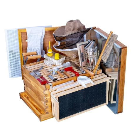 Beekeeper tool kit with hive tools, smoker, and protective gear for beekeeping.